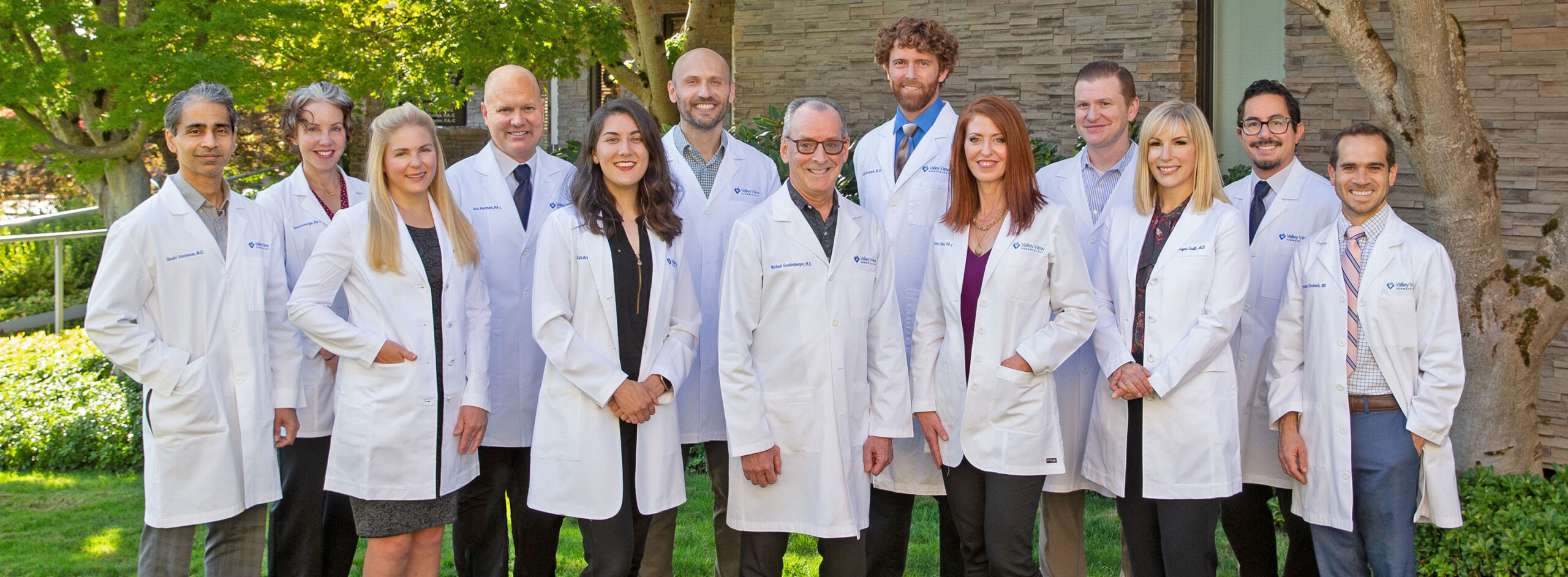 The Valley View Dermatology team in a group photo outside their Salem location.